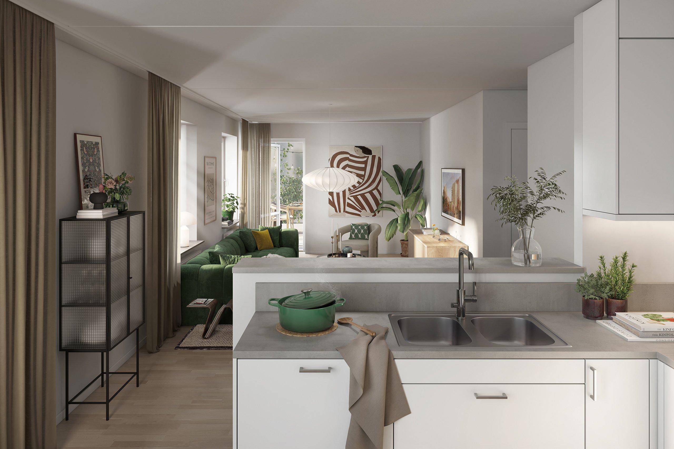 Vitt kök mot ljust vardagsrum med stora fönster.